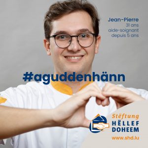Jean-Pierre, Aidesoignant montrant un coaeur avec ses mains.